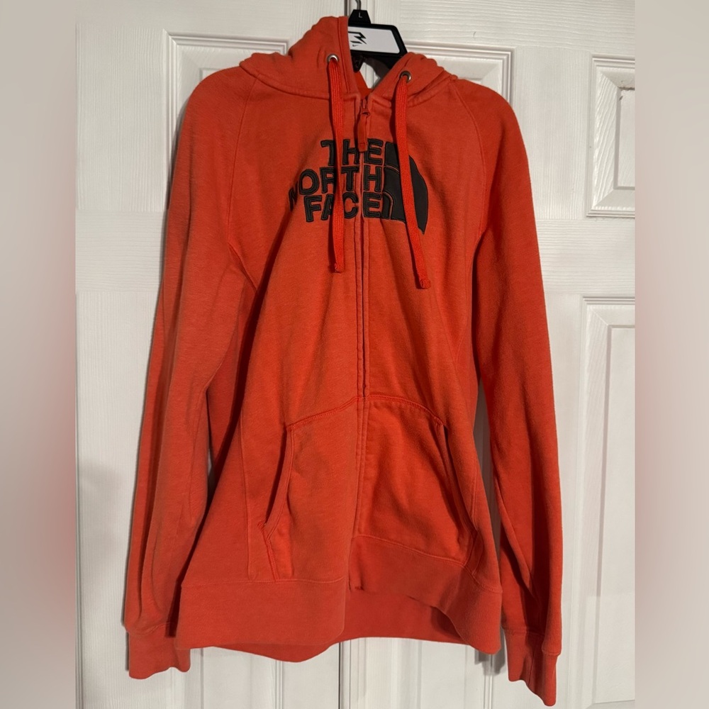 The north face zip up jacket, size large.